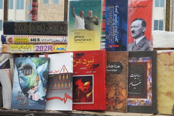 Books on a Kabul bookstore shelf. Pictured are Mein Kampf, Khayyam, Hafiz.